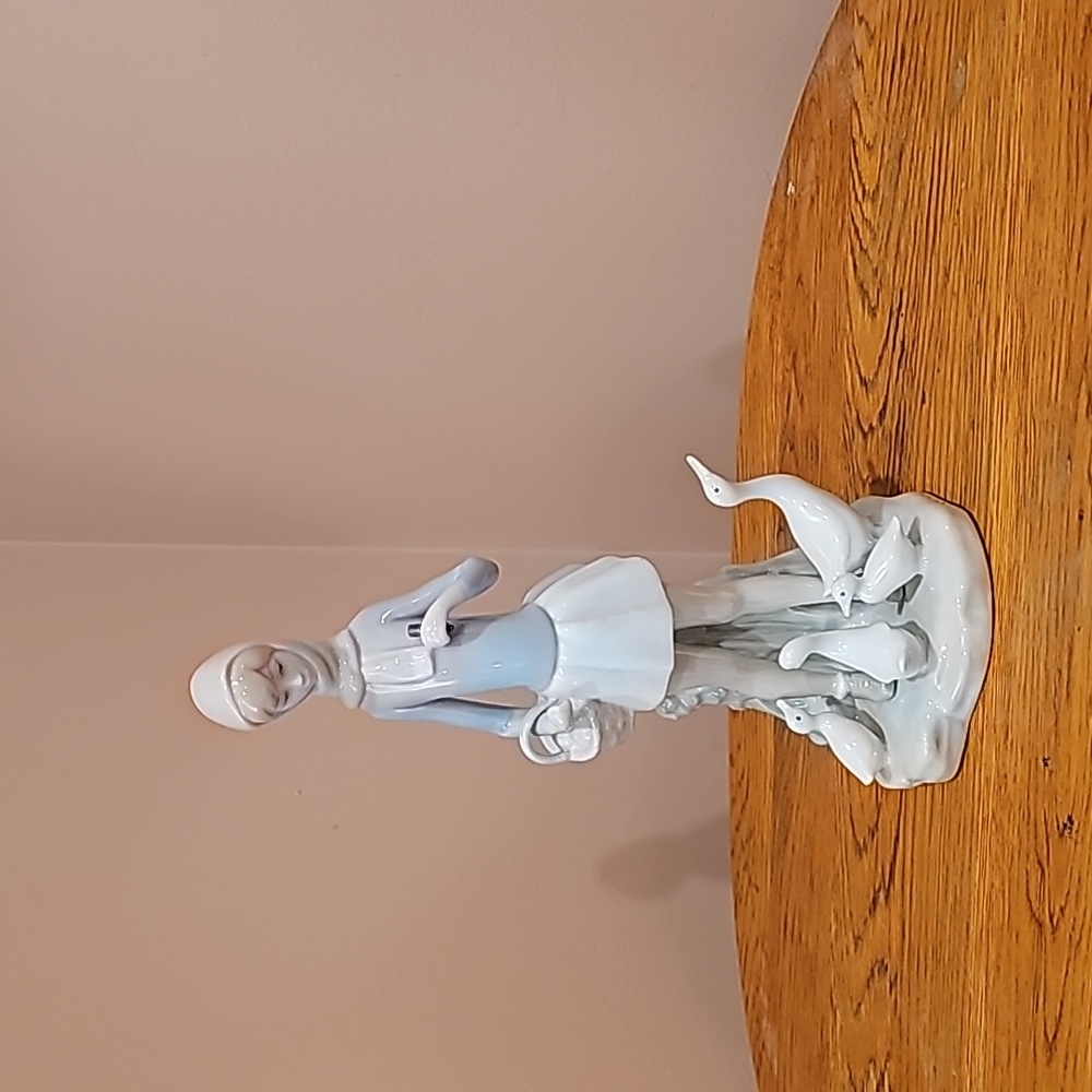 Lladro girl with basket feeding ducks